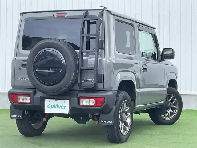 スズキ ジムニー XC 香川県 2019(平31)年 3.9万km ミディアムグレー 社外ＳＤナビ/→フルセグＴＶ/バックカメラ/Bluetooth/CD/社外ショックアムソーバー/社外リアラダー/クルーズコントロール/レーンキープアシスト/衝突軽減システム/横滑り防止機能/ダウンヒルアシストコントロール/アイドリングストップ/パワーステアリング/パワーウィンドウ/エアバック→Ｗ＋サイド/カーテンエアバック/オートエアコン/ETC/シートヒーター/純正ＬＥＤライト/純正アルミホイール/純正フロアマット　/社外ミュージックサーバー（ＳＤなし）　/盗難防止車/プッシュスタート/スマートキー/オートマチックハイビーム/オートライト/アシストミラー/スペアキー1本/背面タイヤ