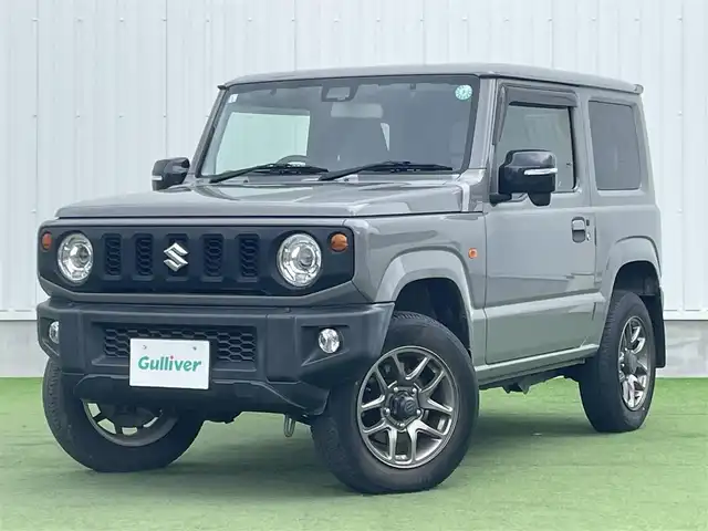スズキ ジムニー XC 香川県 2019(平31)年 3.9万km ミディアムグレー 社外ＳＤナビ/→フルセグＴＶ/バックカメラ/Bluetooth/CD/社外ショックアムソーバー/社外リアラダー/クルーズコントロール/レーンキープアシスト/衝突軽減システム/横滑り防止機能/ダウンヒルアシストコントロール/アイドリングストップ/パワーステアリング/パワーウィンドウ/エアバック→Ｗ＋サイド/カーテンエアバック/オートエアコン/ETC/シートヒーター/純正ＬＥＤライト/純正アルミホイール/純正フロアマット　/社外ミュージックサーバー（ＳＤなし）　/盗難防止車/プッシュスタート/スマートキー/オートマチックハイビーム/オートライト/アシストミラー/スペアキー1本/背面タイヤ