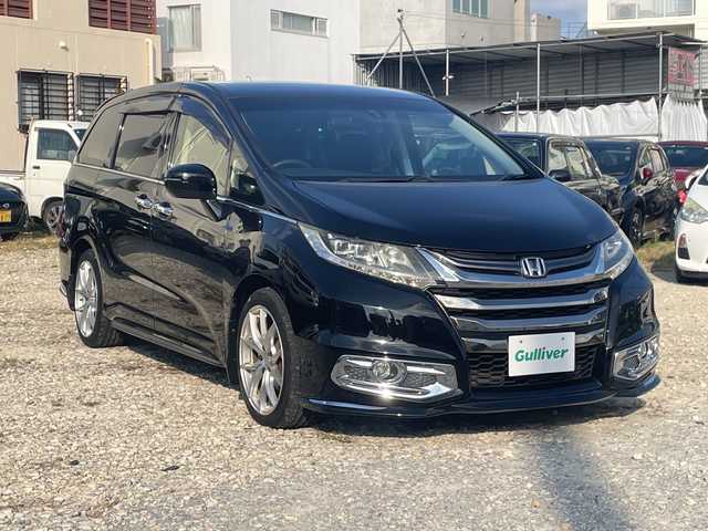 ホンダ オデッセイ アブソルート 沖縄県 2015(平27)年 11.7万km クリスタルブラックパール 純正ナビ　/CD/DVD/BT/フルセグ/フリップダウンモニター　/バックカメラ　/両側パワースライドドア　/クルーズコントロール　/ＬＥＤヘッドライト　/ハーフレザーシート　/社外アルミホイール/ステアリングスイッチ/アイドリングストップ/デジタルインナーミラー/電動格納ミラー/オートライト/スマートキー/ETC