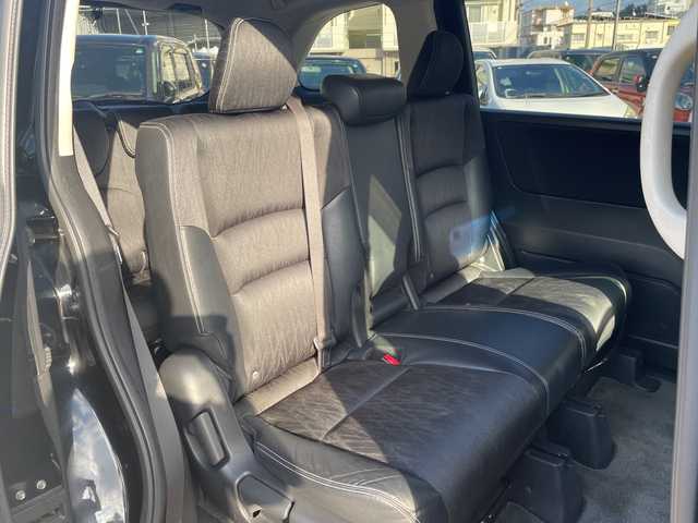 ホンダ オデッセイ アブソルート 沖縄県 2015(平27)年 11.7万km クリスタルブラックパール 純正ナビ　/CD/DVD/BT/フルセグ/フリップダウンモニター　/バックカメラ　/両側パワースライドドア　/クルーズコントロール　/ＬＥＤヘッドライト　/ハーフレザーシート　/社外アルミホイール/ステアリングスイッチ/アイドリングストップ/デジタルインナーミラー/電動格納ミラー/オートライト/スマートキー/ETC