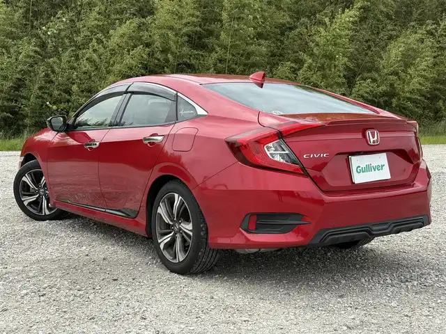 ホンダ シビック セダン 兵庫県 2020(令2)年 4.1万km プレミアムクリスタルレッドM ワンオーナー/純正ナビ/フルセグTV/バックモニター/純正ドラレコ（F/R）/ETC2.0/黒革半シート/両前席パワーシート＆シートヒーター/パドルシフト/レーダークルーズ/レーンキープ/LEDヘッドライト/プッシュスタート＆スマートキー