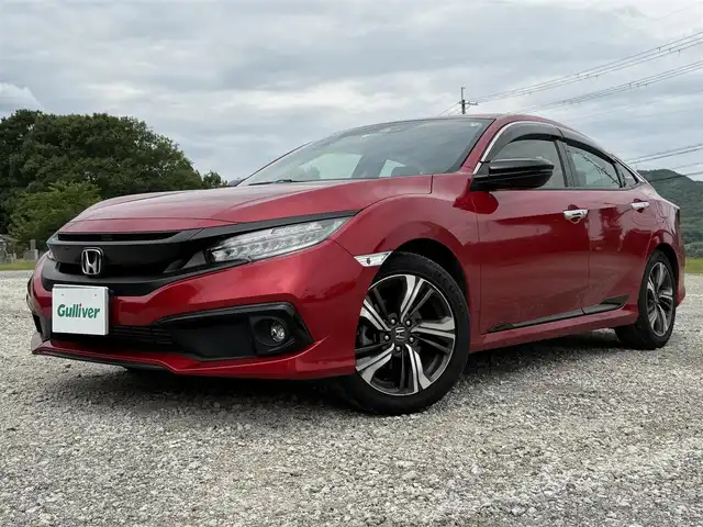 ホンダ シビック セダン 兵庫県 2020(令2)年 4.1万km プレミアムクリスタルレッドM ワンオーナー/純正ナビ/フルセグTV/バックモニター/純正ドラレコ（F/R）/ETC2.0/黒革半シート/両前席パワーシート＆シートヒーター/パドルシフト/レーダークルーズ/レーンキープ/LEDヘッドライト/プッシュスタート＆スマートキー
