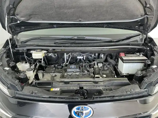 トヨタ ヴォクシー ハイブリッド S－Z 大分県 2023(令5)年 4.5万km アティチュードブラックマイカ 純正ディスプレイオーディオ/CD/DVD/BT/フルセグTV（キャンセラー付き）/純正フリップダウンモニター/ETC2.0 /快適利便パッケージHigh/・ハンズフリースライドドア/・パワーバックドア/・全席シートヒーター/・ステアリングヒーター/・オットマン/電動パーキング/オートブレーキホールド/両側パワースライドドア/トヨタセーフティセンス/ブラインドスポットモニター/クリアランスソナー/ステアリングヒーター/オートハイビーム/LEDヘッドライト/ドライブレコーダー