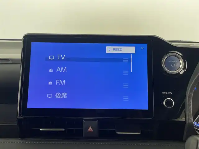 トヨタ ヴォクシー ハイブリッド S－Z 大分県 2023(令5)年 4.5万km アティチュードブラックマイカ 純正ディスプレイオーディオ/CD/DVD/BT/フルセグTV（キャンセラー付き）/純正フリップダウンモニター/ETC2.0 /快適利便パッケージHigh/・ハンズフリースライドドア/・パワーバックドア/・全席シートヒーター/・ステアリングヒーター/・オットマン/電動パーキング/オートブレーキホールド/両側パワースライドドア/トヨタセーフティセンス/ブラインドスポットモニター/クリアランスソナー/ステアリングヒーター/オートハイビーム/LEDヘッドライト/ドライブレコーダー