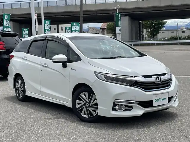 ホンダ シャトル ハイブリッド X 石川県 2016(平28)年 9.1万km ホワイトオーキッドパール 純正メモリーナビ/フルセグTV/バックカメラ/LEDヘッドライト/あんしんパッケージ/クルーズコントロール/ハーフレザーシート/スマートキー/プッシュスタート/電動ミラー/ETC/ドライブレコーダー/オートエアコン