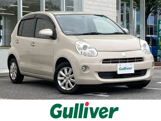 トヨタ パッソ プラスハナ 鳥取県 2011(平23)年 9.8万km キナコメタリック 登録時走行距離：98001km/ディーラー純正SDナビ/　CD ワンセグTV/バックカメラ/オートエアコン/ベンチシート/シートリフター/分割可倒後席シート/レベライザヘッドライト/フォグランプ/ドアバイザー/リモコンキー/スペアキー