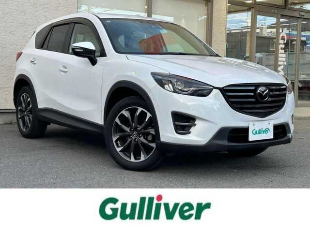 マツダ ＣＸ－５ 25S Lパッケージ 大阪府 2015(平27)年 5.3万km クリスタルホワイトパールマイカ ワンオーナー/革シート/前席パワーシート/前席シートヒーター/SDナビ フルセグTV CD DVD BT/バックカメラ/衝突被害軽減ブレーキ/レーダークルーズコントロール/レーンアシスト/ブラインドスポットモニタ/オートマチックハイビーム/LEDオートヘッドライト/フォグライト/スマートキー2個/バックソナー/ドラレコ/ETC/19インチアルミホイール/横滑り防止/ステアリングリモコン/W サイド カーテン エアバッグ/保証書 取説/禁煙車