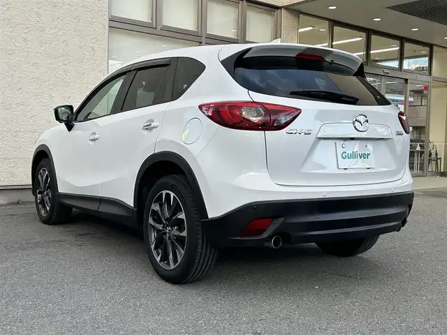 マツダ ＣＸ－５ 25S Lパッケージ 大阪府 2015(平27)年 5.3万km クリスタルホワイトパールマイカ ワンオーナー/革シート/前席パワーシート/前席シートヒーター/SDナビ フルセグTV CD DVD BT/バックカメラ/衝突被害軽減ブレーキ/レーダークルーズコントロール/レーンアシスト/ブラインドスポットモニタ/オートマチックハイビーム/LEDオートヘッドライト/フォグライト/スマートキー2個/バックソナー/ドラレコ/ETC/19インチアルミホイール/横滑り防止/ステアリングリモコン/W サイド カーテン エアバッグ/保証書 取説/禁煙車