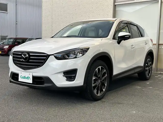 マツダ ＣＸ－５ 25S Lパッケージ 大阪府 2015(平27)年 5.3万km クリスタルホワイトパールマイカ ワンオーナー/革シート/前席パワーシート/前席シートヒーター/SDナビ フルセグTV CD DVD BT/バックカメラ/衝突被害軽減ブレーキ/レーダークルーズコントロール/レーンアシスト/ブラインドスポットモニタ/オートマチックハイビーム/LEDオートヘッドライト/フォグライト/スマートキー2個/バックソナー/ドラレコ/ETC/19インチアルミホイール/横滑り防止/ステアリングリモコン/W サイド カーテン エアバッグ/保証書 取説/禁煙車
