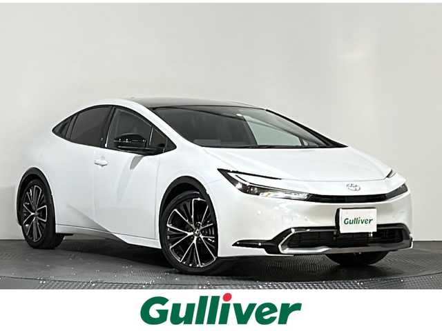 トヨタ プリウス Z 愛媛県 2023(令5)年 1.5万km プラチナホワイトパールマイカ ・１２．３型ナビ（フルセグＴＶ・ＢＴ・ＡｐｐｌｅＣａｒｐｌａｙ・ＦＭＡＭ・ＵＳＢ接続）/・全方位カメラ　/・ＥＴＣ２．０　/・前後ドラレコ一体型デジタルインナーミラー　/・パノラマルーフ　/・レーダークルーズコントロール/・パワーバックドア/・ステアリングヒーター/・衝突軽減ブレーキ/・DN席シートヒーター/ベンチレーション/・パーキングアシスト/・スペアキー/・オートマチックハイビーム/・テレビキャンセラー