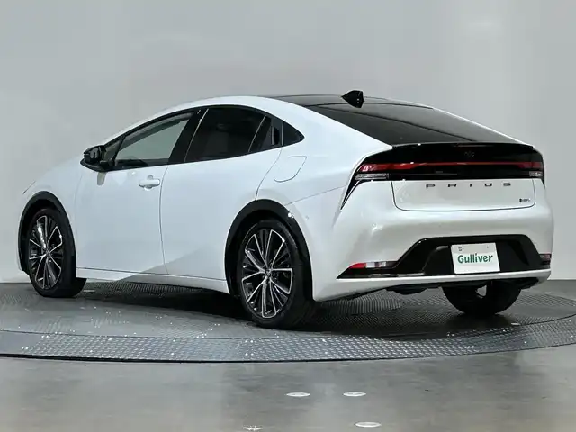 トヨタ プリウス Z 愛媛県 2023(令5)年 1.5万km プラチナホワイトパールマイカ ・１２．３型ナビ（フルセグＴＶ・ＢＴ・ＡｐｐｌｅＣａｒｐｌａｙ・ＦＭＡＭ・ＵＳＢ接続）/・全方位カメラ　/・ＥＴＣ２．０　/・前後ドラレコ一体型デジタルインナーミラー　/・パノラマルーフ　/・レーダークルーズコントロール/・パワーバックドア/・ステアリングヒーター/・衝突軽減ブレーキ/・DN席シートヒーター/ベンチレーション/・パーキングアシスト/・スペアキー/・オートマチックハイビーム/・テレビキャンセラー