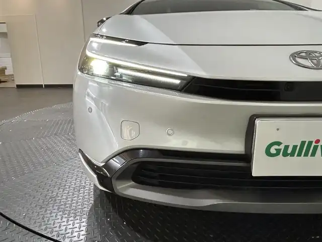 トヨタ プリウス Z 愛媛県 2023(令5)年 1.5万km プラチナホワイトパールマイカ ・１２．３型ナビ（フルセグＴＶ・ＢＴ・ＡｐｐｌｅＣａｒｐｌａｙ・ＦＭＡＭ・ＵＳＢ接続）/・全方位カメラ　/・ＥＴＣ２．０　/・前後ドラレコ一体型デジタルインナーミラー　/・パノラマルーフ　/・レーダークルーズコントロール/・パワーバックドア/・ステアリングヒーター/・衝突軽減ブレーキ/・DN席シートヒーター/ベンチレーション/・パーキングアシスト/・スペアキー/・オートマチックハイビーム/・テレビキャンセラー