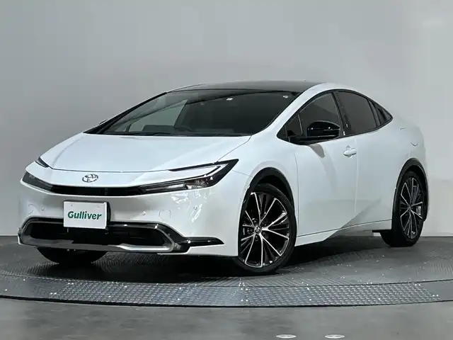 トヨタ プリウス Z 愛媛県 2023(令5)年 1.5万km プラチナホワイトパールマイカ ・１２．３型ナビ（フルセグＴＶ・ＢＴ・ＡｐｐｌｅＣａｒｐｌａｙ・ＦＭＡＭ・ＵＳＢ接続）/・全方位カメラ　/・ＥＴＣ２．０　/・前後ドラレコ一体型デジタルインナーミラー　/・パノラマルーフ　/・レーダークルーズコントロール/・パワーバックドア/・ステアリングヒーター/・衝突軽減ブレーキ/・DN席シートヒーター/ベンチレーション/・パーキングアシスト/・スペアキー/・オートマチックハイビーム/・テレビキャンセラー