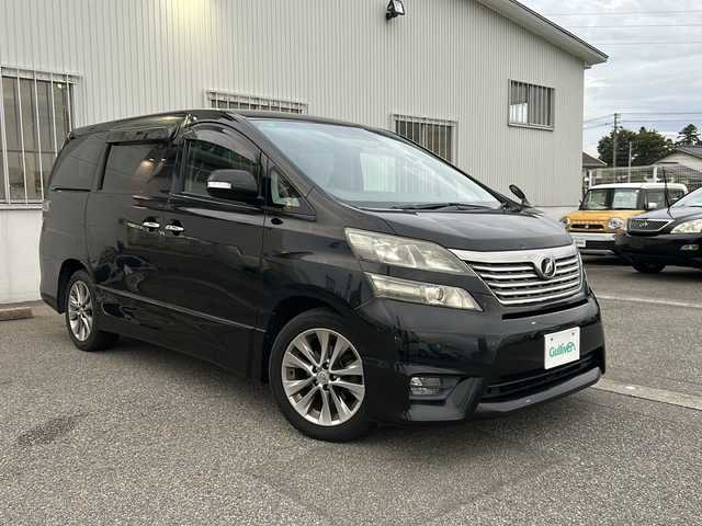 トヨタ ヴェルファイア 2．4Z プラチナセレクションⅡ 富山県 2011(平23)年 9.8万km ブラック ワンオーナー/４WD/両側パワースライドドア/スマートキー/純正メモリーナビ（NSZT-W60）/純正フリップダウンモニター/DVD/MSV/フルセグTV/バックカメラ/ビルトインETC/前後ドラレコ/純正１８インチAW/HIDヘッドライト/フォグ/クリアランスソナー/オットマンシート/電格ウィンカーミラー/木目・革巻きステアリング/ステアリングスイッチ/純正ドアバイザー/純正フロアマット/プッシュスタート/保証書・取説