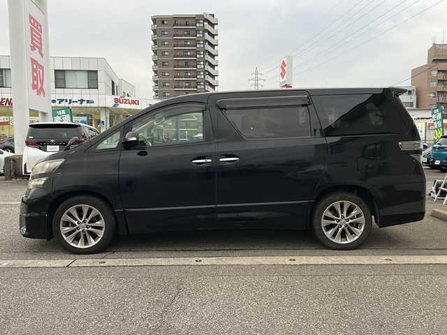 トヨタ ヴェルファイア 2．4Z プラチナセレクションⅡ 富山県 2011(平23)年 9.8万km ブラック ワンオーナー/４WD/両側パワースライドドア/スマートキー/純正メモリーナビ（NSZT-W60）/純正フリップダウンモニター/DVD/MSV/フルセグTV/バックカメラ/ビルトインETC/前後ドラレコ/純正１８インチAW/HIDヘッドライト/フォグ/クリアランスソナー/オットマンシート/電格ウィンカーミラー/木目・革巻きステアリング/ステアリングスイッチ/純正ドアバイザー/純正フロアマット/プッシュスタート/保証書・取説