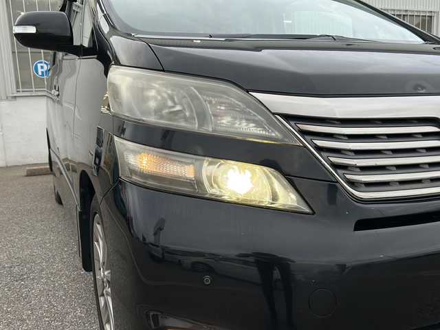トヨタ ヴェルファイア 2．4Z プラチナセレクションⅡ 富山県 2011(平23)年 9.8万km ブラック ワンオーナー/４WD/両側パワースライドドア/スマートキー/純正メモリーナビ（NSZT-W60）/純正フリップダウンモニター/DVD/MSV/フルセグTV/バックカメラ/ビルトインETC/前後ドラレコ/純正１８インチAW/HIDヘッドライト/フォグ/クリアランスソナー/オットマンシート/電格ウィンカーミラー/木目・革巻きステアリング/ステアリングスイッチ/純正ドアバイザー/純正フロアマット/プッシュスタート/保証書・取説