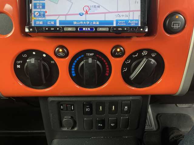 トヨタ ＦＪクルーザー 埼玉県 2014(平26)年 10.9万km オレンジ/ホワイト 社外ナビ/　（FM/AM/Bluetooth/iPod/DVD/CD）/フルセグテレビ/バックカメラ/ドライブレコーダー/フロアマット/コーナーセンサー/背面タイヤ/ETC