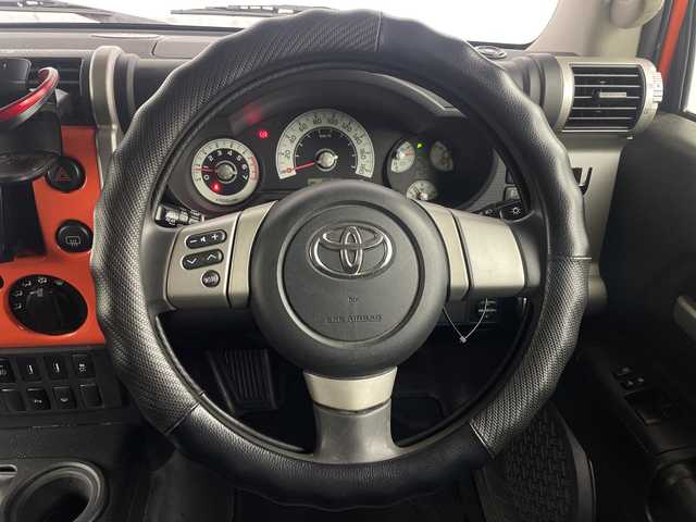 トヨタ ＦＪクルーザー 埼玉県 2014(平26)年 10.9万km オレンジ/ホワイト 社外ナビ/　（FM/AM/Bluetooth/iPod/DVD/CD）/フルセグテレビ/バックカメラ/ドライブレコーダー/フロアマット/コーナーセンサー/背面タイヤ/ETC