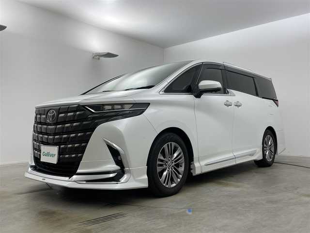 トヨタ アルファードハイブリット Z 岡山県 2024(令6)年 1万km プラチナホワイトパールマイカ モデリスタエアロ/左右独立ムーンルーフ/純正１４インチディスプレイオーディオ/【ナビ/Bluetooth/フルセグTV/Carplay/HDMI】/パノラミックビューモニター/ユニバーサルステップ/ＴＶキャンセラー/１００Ｖ電源/デジタルインナーミラー/ヘッドアップディスプレイ/社外ドライブレコーダー（全方位）/型番:ZDR-037/シートヒーター（1列目/2列目）/シートベンチレーション（1列目/2列目）/ステアリングヒーター/ＨＤＭＩ接続/ビルトインETC2.0/社外レーダー/LEDヘッドライト/保証書/取扱説明書/スマートキー×2