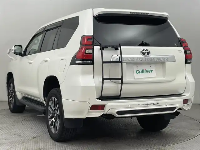 トヨタ ランドクルーザー プラド TX Lパッケージ 道央・札幌 2022(令4)年 2.8万km ホワイトパールクリスタルシャイン ・４WD/・TRDエアロ/・ムーンルーフ/・KENWOODフローディングナビ/　CD／DVD／Bluetooth／フルセグ/・バックカメラ/・純正ビルトインETC/・トヨタセーフティセンス/・プリクラッシュセーフティ/・レーダークルーズコントロール/・オートマチックハイビーム/・レーンキープアシスト/・前後コーナーセンサー/・ベージュレザーシート/・前席パワーシート/・前席シートヒーター＆シートエアコン/・純正フロアマット/・純正AW19インチ/・バグガード/・NashFabCoリアラダー/・LEDヘッドライト/・フォグライト/・スマートキー/・プッシュスタート/・取扱説明書/・保証書
