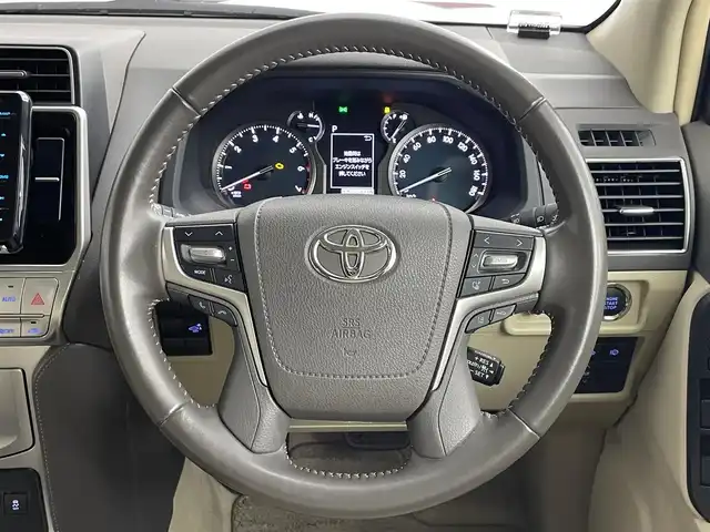 トヨタ ランドクルーザー プラド TX Lパッケージ 道央・札幌 2022(令4)年 2.8万km ホワイトパールクリスタルシャイン ・４WD/・TRDエアロ/・ムーンルーフ/・KENWOODフローディングナビ/　CD／DVD／Bluetooth／フルセグ/・バックカメラ/・純正ビルトインETC/・トヨタセーフティセンス/・プリクラッシュセーフティ/・レーダークルーズコントロール/・オートマチックハイビーム/・レーンキープアシスト/・前後コーナーセンサー/・ベージュレザーシート/・前席パワーシート/・前席シートヒーター＆シートエアコン/・純正フロアマット/・純正AW19インチ/・バグガード/・NashFabCoリアラダー/・LEDヘッドライト/・フォグライト/・スマートキー/・プッシュスタート/・取扱説明書/・保証書