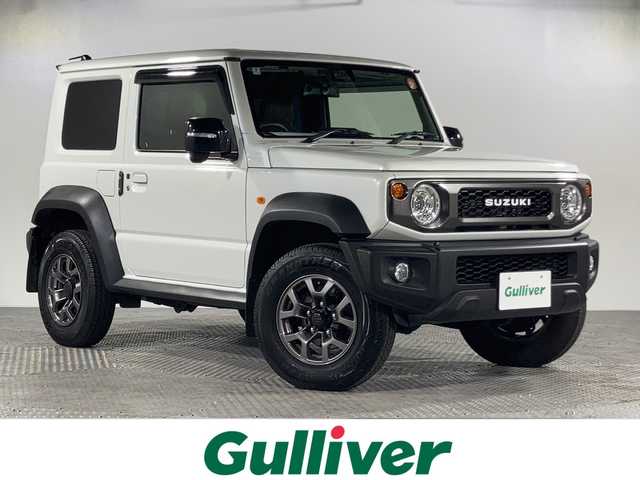 スズキ ジムニー シエラ JC 沖縄県 2024(令6)年 0.6万km ピュアホワイトP 禁煙車/ワンオーナー/社外7インチナビ（NDV-711W）/（フルセグ/CD/DVD/BT）/デュアルセンサーブレーキサポート/クルーズコントロール/社外デジタルインナーミラー/社外フロアマット/純正15インチアルミホイール/マッドフラップ/革調シートカバー/D/N席シートヒーター/オートライト/オートハイビーム/LEDヘッドライト/プッシュスタート/スマートキー×2/ETC/取扱説明書/保証書