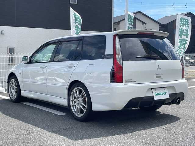 三菱 ランサー ワゴン GT エボリューション 三重県 2005(平17)年 7.7万km シルキーホワイト 登録時76996km/禁煙車/ＫＥＸＷＯＯＤ７インチディスプレイオーディオ/・Ｂｌｕｅｔｏｏｔｈ・ｃａｒｐｌａｙ・ＣＤ・ＵＳＢ/バックカメラ/ＲＥＣＡＲＯシート/黒ハーフレザーシート/ＭＯＭＯステ/ＡＵＴＯライト/ＥＴＣ/電動格納ミラー/AAC/リモコンキー