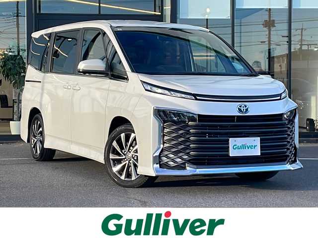 トヨタ ヴォクシー ハイブリッド S－Z 茨城県 2024(令6)年 1.4万km ホワイトパールクリスタルシャイン 純正SDナビ(Bluetooth/アラウンドビューモニター)/ETC2.0/アダプティブクルーズコントロール/横滑り防止装置/コーナーセンサー/レーンキープアシスト/LEDオートライト/オートマチックハイビーム/USB入力端子/パーキングアシスト/スマートキー/ハーフレザーシート/シートヒーター/冷房WAC/純正フロアマット/17インチ純正アルミホイール