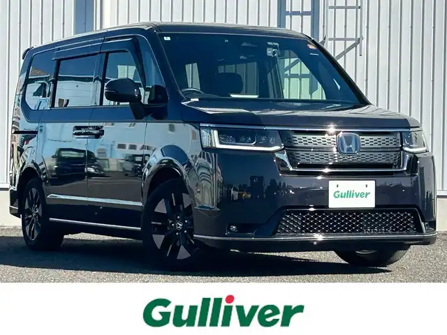 ホンダ ステップワゴン スパーダ eHEV 熊本県 2022(令4)年 2.8万km トワイライトミストブラックパール 純正9インチナビ/・AM/FM/CD/DVD/BT/SD/・フルセグTV/・バックカメラ/ホンダセンシング/・衝突軽減ブレーキ/・レーンキープアシスト/・先行車発進お知らせ/・車線維持支援システム/・ブラインドスポットモニター/・標識認識機能/・先行車発進お知らせ/・アダプティブクルーズコントロール/パワーテールゲート/2列目オットマン/ハーフレザーシート/前席シートヒーター/革巻きステアリング/ステアリングスイッチ/パドルシフト/電動パーキングブレーキ/オートホールドブレーキ/LEDヘッドライト/フォグランプ/電動格納ミラー/ウインカーミラー/純正フロアマット/純正アルミホイール/ドアバイザー