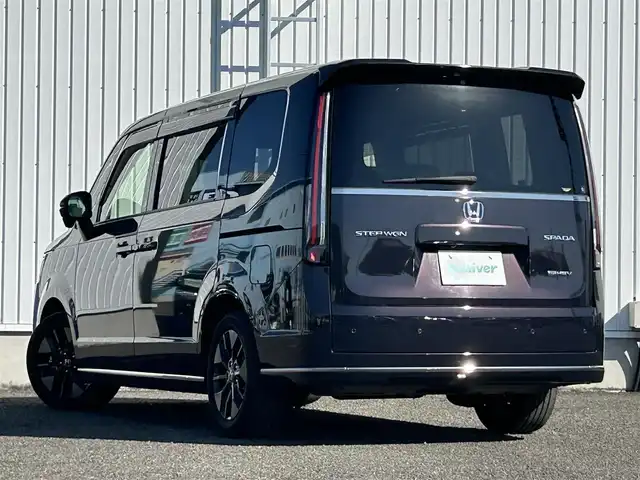 ホンダ ステップワゴン スパーダ eHEV 熊本県 2022(令4)年 2.8万km トワイライトミストブラックパール 純正9インチナビ/・AM/FM/CD/DVD/BT/SD/・フルセグTV/・バックカメラ/ホンダセンシング/・衝突軽減ブレーキ/・レーンキープアシスト/・先行車発進お知らせ/・車線維持支援システム/・ブラインドスポットモニター/・標識認識機能/・先行車発進お知らせ/・アダプティブクルーズコントロール/パワーテールゲート/2列目オットマン/ハーフレザーシート/前席シートヒーター/革巻きステアリング/ステアリングスイッチ/パドルシフト/電動パーキングブレーキ/オートホールドブレーキ/LEDヘッドライト/フォグランプ/電動格納ミラー/ウインカーミラー/純正フロアマット/純正アルミホイール/ドアバイザー
