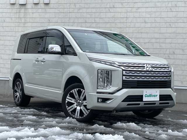 三菱 デリカＤ：５ P 山形県 2021(令3)年 6.3万km ウォームホワイトパール ワンオーナー/4WD/純正10.1インチナビ/・TV/AM/FM/CD/DVD/Bluetooth/レーダークルーズコントロール/アイドリングストップ/ブラインドスポットモニター/衝突被害軽減ブレーキ/誤発進抑制制御/車線逸脱警報/横滑り防止装置/盗難防止装置/LEDヘッドライト/オートライト/両側パワースライドドア/電動パーキングブレーキ/パワーシート（D席）/シートヒーター（D/N席）/パワーバックドア/フリップダウンモニター/オートステップ/全周囲カメラ/純正フロアマット/純正ドアバイザー/ETC/保証書/取扱説明書