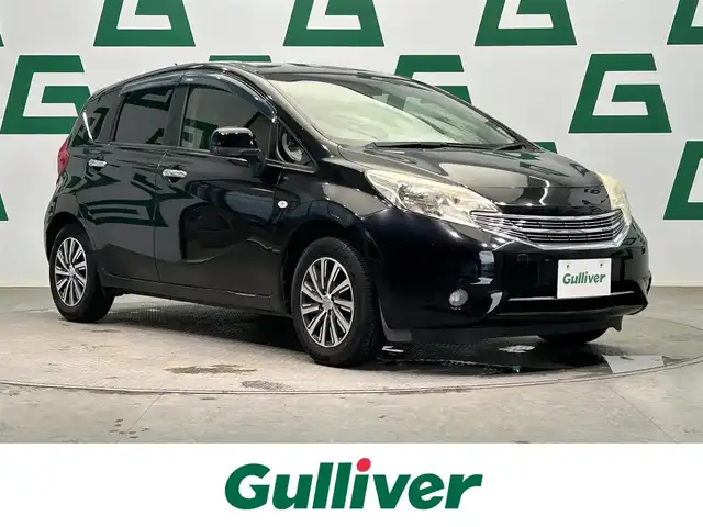 日産 ノート アクシス 鹿児島県 2013(平25)年 13.1万km スーパーブラック 禁煙車　/純正ナビ/・フルセグ/・DVD/CD/・BT/・USB/社外前方ドラレコ/バックカメラ/アイドリングストップ/ブレーキアシスト/オートライト/純正(フロアマット/アルミ/ドアバイザー)/スマートキー/Pスタート/ハロゲンライト