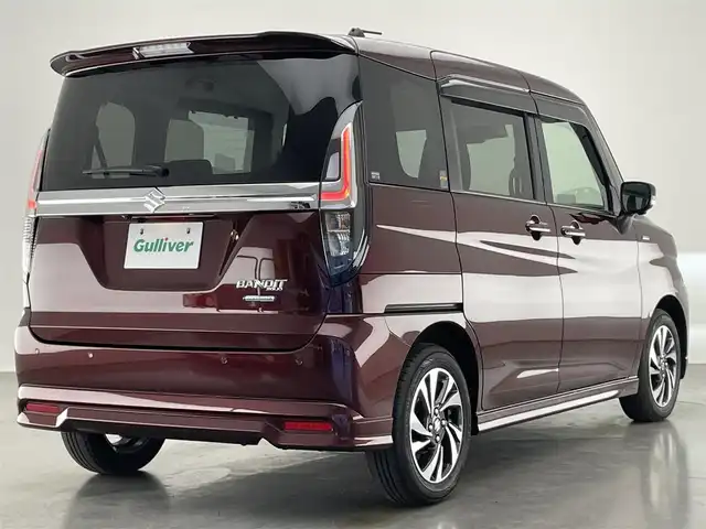 スズキ ソリオ バンディット HV MV 愛知県 2022(令4)年 1万km メロウディープレッドパール 純正９型ナビ　全方位カメラ　ＨＵＤ　両側パワスラ　禁煙　フルセグＴＶ　ＤＶＤ　追従クルコン　ＵＳＢ　シートヒーター　デュアルカメラブレーキサポート　ＥＴＣ　ＬＥＤオートライト　フォグ　リヤパーキングセンサー　純正マット　両側パワースライドドア　Bluetooth　衝突軽減　車線逸脱　スマートキー　プッシュスタート　リヤサーキュレーター