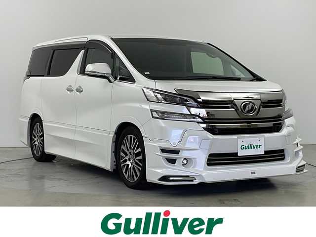 トヨタ ヴェルファイア ZA Gエディション 道央・札幌 2016(平28)年 3.2万km ホワイトパールクリスタルシャイン TRDエアロ（FSR）/TRDマフラー/JBLサウンド/4WD/全周囲カメラ/プリクラッシュセーフティー/レーダークルーズコントロール/オートハイビーム/メーカーOPナビ/・BT.CD.DVD.USB.SD/ワンセグTV/純正フリップダウンモニター/電動リアゲート/両側パワースライドドア/ハーフレザーシート/全席パワーシート/オットマン/ウッドコンビステアリング/ステアリングヒーター/ステアリングスイッチ/ビルトインETC/ドライブレコーダー（F）/プッシュスタート/スマートキー×2/電動パーキングブレーキ/LEDヘッドライト/LEDフォグライト/純正18インチAW/純正フロアマット/ドアバイザー/ロールサンシェード