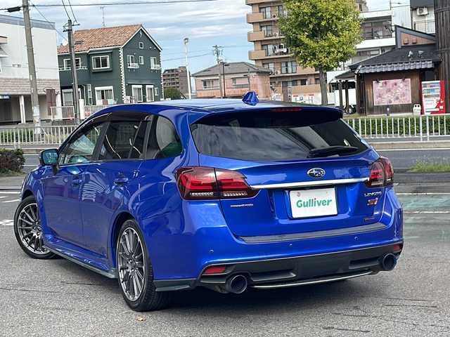 スバル レヴォーグ 2．0STIスポーツアイサイト 愛知県 2016(平28)年 9.8万km WRブルーパール /純正ディーラーナビ//４WD//フルセグTV//Bluetooth・AM・FM//CD・DVD//アドバンスドパッケージ//ガナドールマフラー//サンルーフ//赤黒レザーシート//運転席シートメモリ//前席パワーシート・シートヒーター//アイサイトver3//ブラインドスポットモニター//衝突軽減ブレーキ//追従クルーズコントロール//アクティブレーンキープ//ハイビームアシスト//リアビークルディテクション//ビルトインETC//フロント・リアUSB電源//LEDヘッドライト//LEDフォグランプ//LEDアクセサリーライナー//純正18インチアルミ//社外スタッドレスタイヤ・ホイール車載//ASSURAレーダー//ドライブレコーダー//革巻きステアリング//純正ドアバイザー//保証書・取説・スペアキー