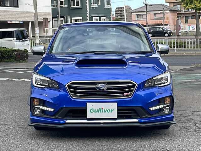 スバル レヴォーグ 2．0STIスポーツアイサイト 愛知県 2016(平28)年 9.8万km WRブルーパール /純正ディーラーナビ//４WD//フルセグTV//Bluetooth・AM・FM//CD・DVD//アドバンスドパッケージ//ガナドールマフラー//サンルーフ//赤黒レザーシート//運転席シートメモリ//前席パワーシート・シートヒーター//アイサイトver3//ブラインドスポットモニター//衝突軽減ブレーキ//追従クルーズコントロール//アクティブレーンキープ//ハイビームアシスト//リアビークルディテクション//ビルトインETC//フロント・リアUSB電源//LEDヘッドライト//LEDフォグランプ//LEDアクセサリーライナー//純正18インチアルミ//社外スタッドレスタイヤ・ホイール車載//ASSURAレーダー//ドライブレコーダー//革巻きステアリング//純正ドアバイザー//保証書・取説・スペアキー