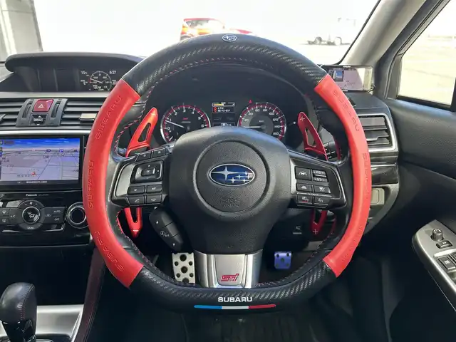 スバル レヴォーグ 2．0STIスポーツアイサイト 静岡県 2016(平28)年 9.8万km WRブルーパール 純正ディーラーナビ/４WD/フルセグTV/Bluetooth・AM・FM/CD・DVD/アドバンスドパッケージ/ガナドールマフラー/サンルーフ/赤黒レザーシート/運転席シートメモリ/前席パワーシート・シートヒーター/アイサイトver3/ブラインドスポットモニター/衝突軽減ブレーキ/追従クルーズコントロール/アクティブレーンキープ/ハイビームアシスト/リアビークルディテクション/ビルトインETC/フロント・リアUSB電源/LEDヘッドライト/LEDフォグランプ/LEDアクセサリーライナー/純正18インチアルミ/社外スタッドレスタイヤ・ホイール車載/ASSURAレーダー/ドライブレコーダー/革巻きステアリング/純正ドアバイザー/保証書・取説・スペアキー