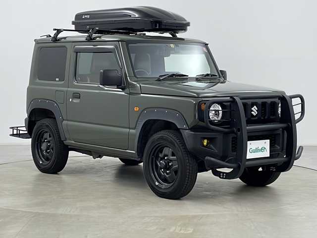 スズキ ジムニー XG 道央・札幌 2020(令2)年 3.5万km ジャングルグリーン パートタイム4WD/社外マフラー/革調シートカバー/ETC/リモコンキー/純正ラバーマット/社外ドライブレコーダー/フロントグリルガード/リアキャリア/ルーフキャリア/フォグランプ/ヘッドライトレベライザー/夏タイヤ積込有/取扱説明書/保証書/背面タイヤ積込/ヒッチメンバー