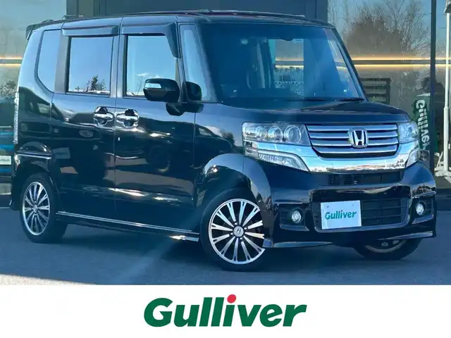 ホンダ Ｎ ＢＯＸ カスタム G ターボSSパッケージ 栃木県 2015(平27)年 7万km スマートブラック CTBA/純正SDナビ/・ワンセグTV/・CD/DVD/BT/・USB/iPod/SD/・AM.FM/バックカメラ/ETC/ドライブレコーダー/クルーズコントロール/両側電動スライドドア/革巻きステアリング/ステアリングスイッチ/パドルシフト/スマートキー/プッシュスタート/HIDヘッドライト/フォグランプ/オートライト/GPSレーダー/純正15インチAW/純正フロアマット/ドアバイザー/リアスモークフィルム/横滑り防止システム/電動格納ウィンカーミラー