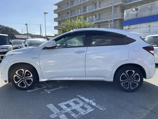 ホンダ ヴェゼル ハイブリッド Z 兵庫県 2014(平26)年 10.2万km ホワイトオーキッドパール 【(株)IDOMが運営する【じしゃロン姫路店】の自社ローン対象車両になります。こちらは現金ご利用時の価格です。自社ローンご希望の方は別途その旨お申付け下さい。】/純正ナビ/フルセグ/バックカメラ/クルーズコントロール/パドルシフト/ＥＴＣ/ハーフレザーシート/シートヒーター/ステアリングスイッチ/スマートキー/プッシュスタート/LEDヘッドライト