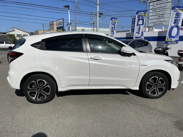 ホンダ ヴェゼル ハイブリッド Z 兵庫県 2014(平26)年 10.2万km ホワイトオーキッドパール 【(株)IDOMが運営する【じしゃロン姫路店】の自社ローン対象車両になります。こちらは現金ご利用時の価格です。自社ローンご希望の方は別途その旨お申付け下さい。】/純正ナビ/フルセグ/バックカメラ/クルーズコントロール/パドルシフト/ＥＴＣ/ハーフレザーシート/シートヒーター/ステアリングスイッチ/スマートキー/プッシュスタート/LEDヘッドライト