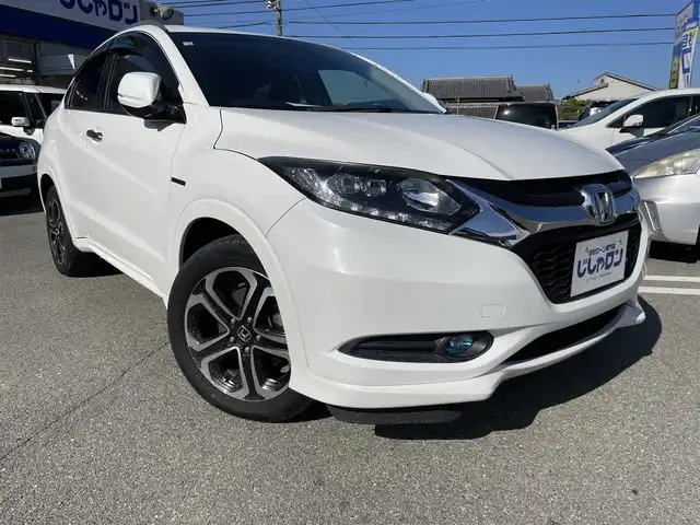 ホンダ ヴェゼル ハイブリッド Z 兵庫県 2014(平26)年 10.2万km ホワイトオーキッドパール 【(株)IDOMが運営する【じしゃロン姫路店】の自社ローン対象車両になります。こちらは現金ご利用時の価格です。自社ローンご希望の方は別途その旨お申付け下さい。】/純正ナビ/フルセグ/バックカメラ/クルーズコントロール/パドルシフト/ＥＴＣ/ハーフレザーシート/シートヒーター/ステアリングスイッチ/スマートキー/プッシュスタート/LEDヘッドライト