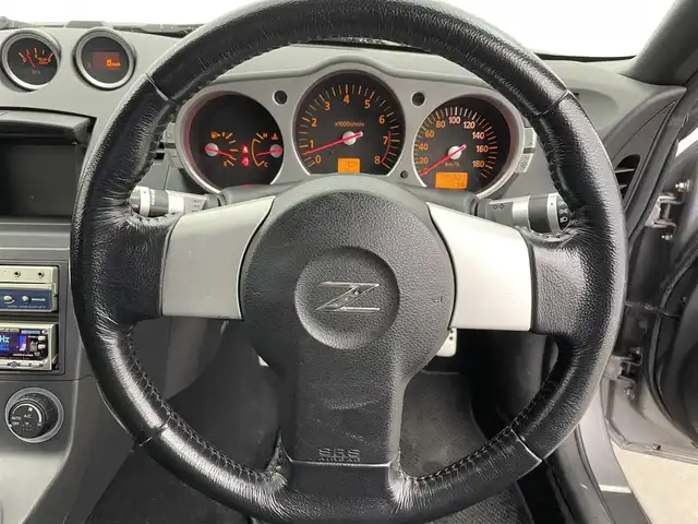 日産 フェアレディ Ｚ 富山県 2003(平15)年 5万km スパークリングシルバー カーオーディオ/CD/CDチェンジャー/トラクションコントロールシステム/センターコンソール/ETC/盗難防止装置/フロアマット純正/社外AW/キセノンライト/ABS/パワーステアリング/パワーウインドウ/リモコンキー×1