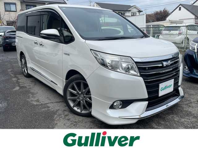 トヨタ ノア ハイブリッド G 神奈川県 2014(平26)年 8.6万km ホワイトパールクリスタルシャイン プッシュスタート/ビルトインETC/純正SDナビ/地デジTV/Bluetooth接続/DISC/AM/FM/クルーズコントロール/フリップダウンモニター/前席シートヒーター/横滑り防止装置/置くだけ充電/オートライト/LEDライト/フォグライト/電動格納ミラー/純正フロアマット
