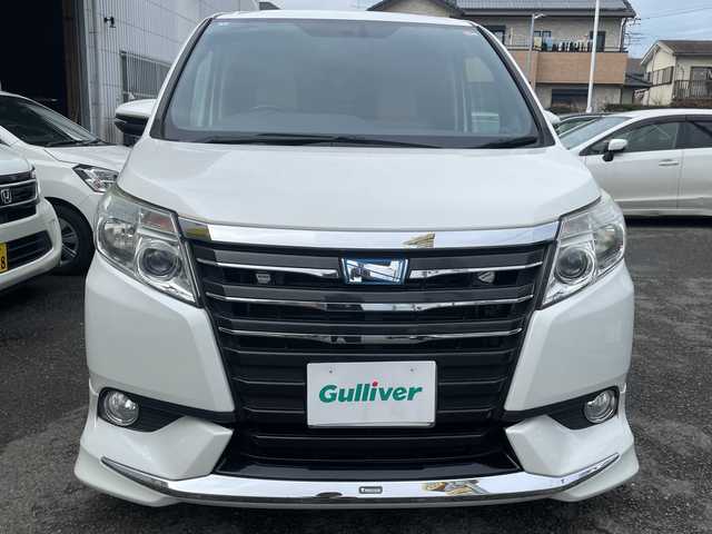 トヨタ ノア ハイブリッド G 神奈川県 2014(平26)年 8.6万km ホワイトパールクリスタルシャイン プッシュスタート/ビルトインETC/純正SDナビ/地デジTV/Bluetooth接続/DISC/AM/FM/クルーズコントロール/フリップダウンモニター/前席シートヒーター/横滑り防止装置/置くだけ充電/オートライト/LEDライト/フォグライト/電動格納ミラー/純正フロアマット