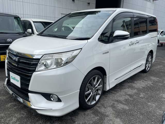 トヨタ ノア ハイブリッド G 神奈川県 2014(平26)年 8.6万km ホワイトパールクリスタルシャイン プッシュスタート/ビルトインETC/純正SDナビ/地デジTV/Bluetooth接続/DISC/AM/FM/クルーズコントロール/フリップダウンモニター/前席シートヒーター/横滑り防止装置/置くだけ充電/オートライト/LEDライト/フォグライト/電動格納ミラー/純正フロアマット