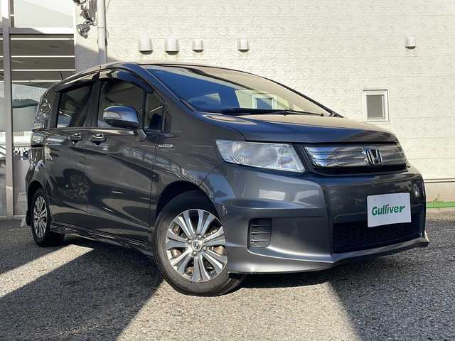 ホンダ フリード スパイク ハイブリット ジャストセレクション 兵庫県 2012(平24)年 3.4万km ポリッシュドメタルメタリック 純正ディーラーナビ（SD）/　AM/FM・USB・IPod・CD・DVD・SD・handsfree/フルセグTV/バックカメラ/両側パワースライドドア/クルーズコントロール/アイドリングストップ/アンチロック・ブレーキ・システム/盗難防止装置/横滑り防止装置/オートライト/純正アルミホイール/純正フロアマット/スマートキー/スペアキー×2/取扱説明書/保証書