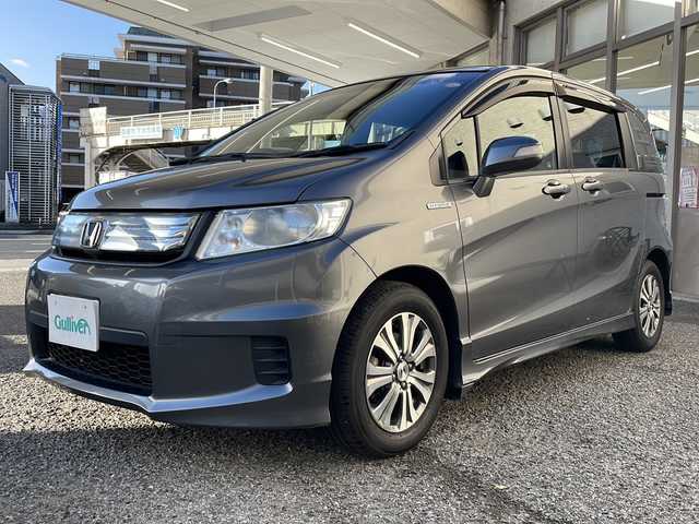 ホンダ フリード スパイク ハイブリット ジャストセレクション 兵庫県 2012(平24)年 3.4万km ポリッシュドメタルメタリック 純正ディーラーナビ（SD）/　AM/FM・USB・IPod・CD・DVD・SD・handsfree/フルセグTV/バックカメラ/両側パワースライドドア/クルーズコントロール/アイドリングストップ/アンチロック・ブレーキ・システム/盗難防止装置/横滑り防止装置/オートライト/純正アルミホイール/純正フロアマット/スマートキー/スペアキー×2/取扱説明書/保証書