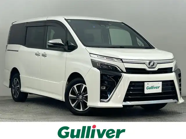 トヨタ ヴォクシー ZS 煌Ⅱ 道央・札幌 2019(令1)年 8.2万km ホワイトパールクリスタルシャイン ・4WD/・トヨタセーフティセンス/・衝突被害軽減ブレーキ/・レーンキープアシスト/・レーダークルーズコントロール/・オートハイビーム/・先行車発進告知/・純正メモリナビ/・フルセグ/BT/CD/DVD/・バックカメラ/・ビルトインETC/・両側パワースライドドア/・純正エンジンスターター/・前後ドライブレコーダー/・ドアロック連動ミラー/・横滑り防止装置/・スマートキー/・プッシュスタート/・MTモード