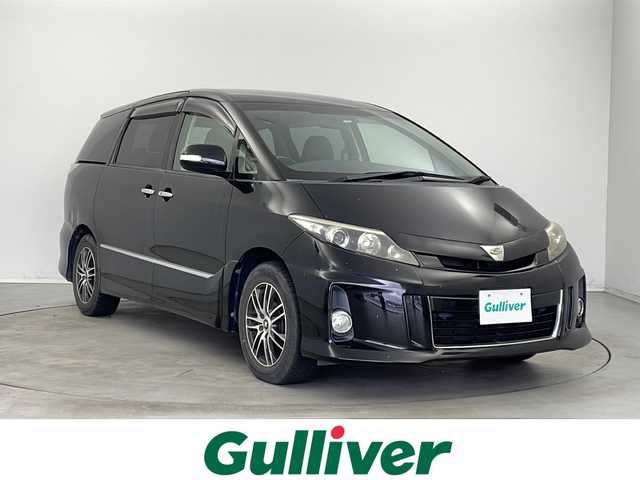 トヨタ エスティマ アエラス プレミアムエディション 新潟県 2013(平25)年 10.4万km ブラック 　バックカメラ/　クルーズコントロール/　ドアバイザー/　プッシュスタート/　両側パワースライドドア/　ETC/　HIDヘッドライト/　オートライト/　ハーフレザーシート/　純正AW車載/　ウィンカーミラー/　MTモード付AT